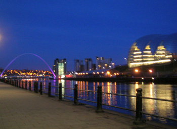 Photograph of the Sage, Baltic and Millennium Bridge lit up at night
