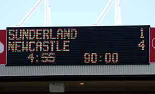 A photograph of the scoreboard showing the glorious 1-4 full time score