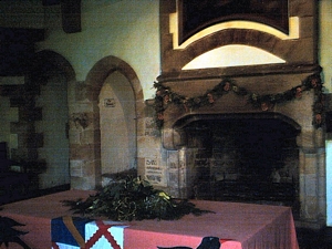 Bolton Castle: Photograph of the solar showing the fireplace and entrance ways to the nursery and bedchambers