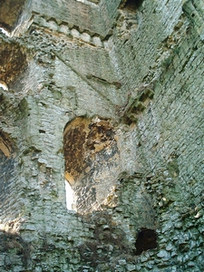 Helmsley Castle: Photograph of the interior of the east tower's western wall. The original roofline and supporting corbels for later floors are clearly visable