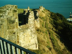 Scarborough Castle: Photograph looking along the curtain wall from the viewing platform on top